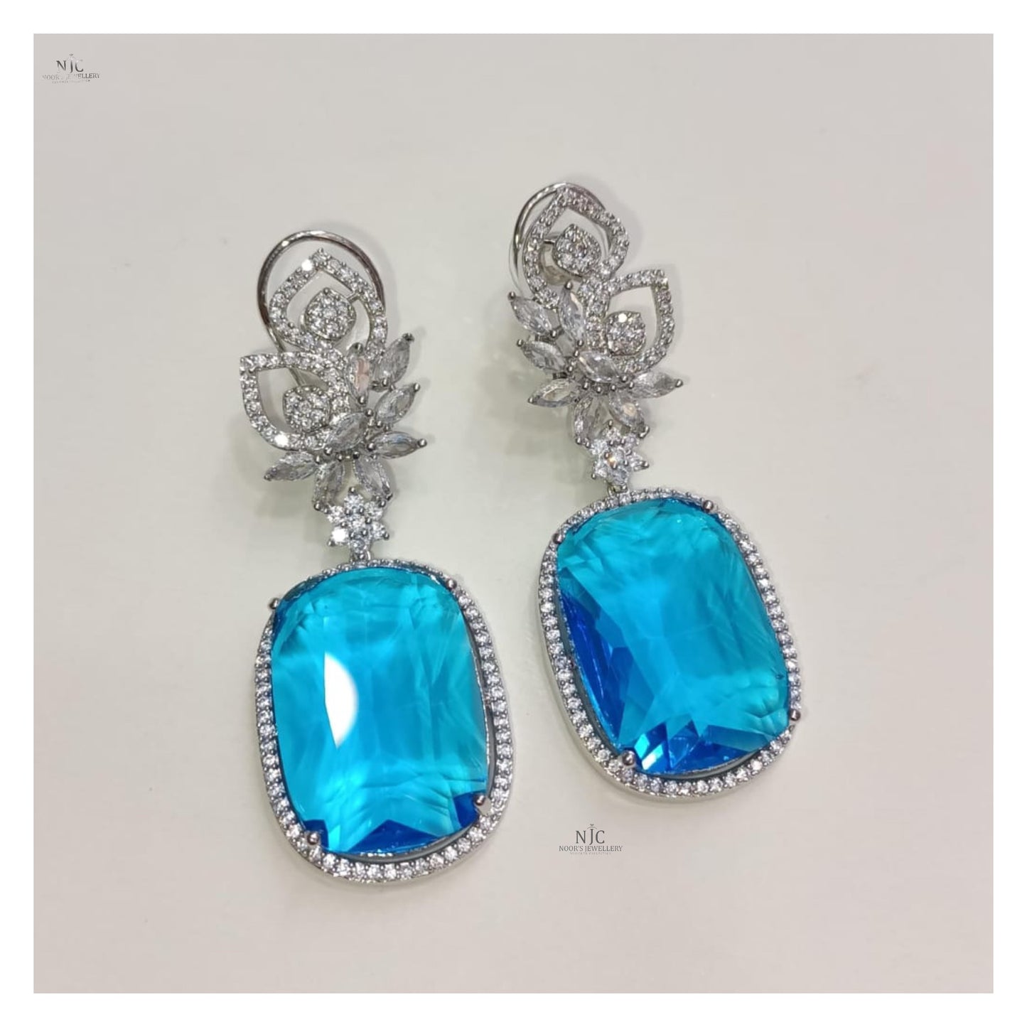 Double stone fancy earrings