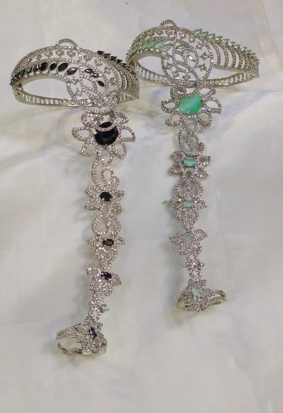 Karas with attached finger ring