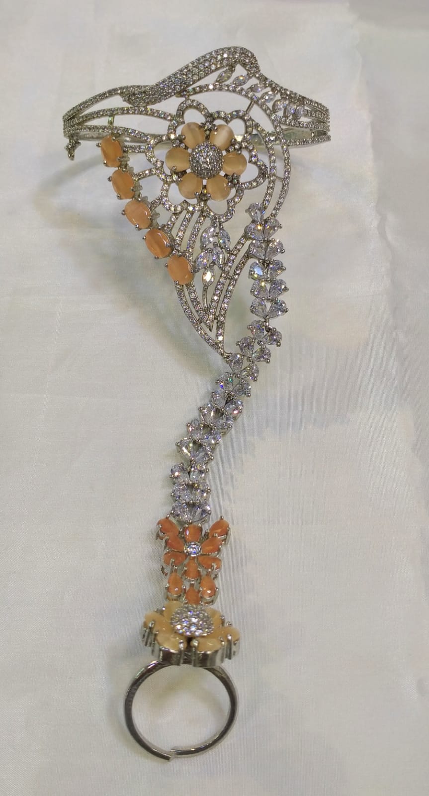 Karas with attached finger ring